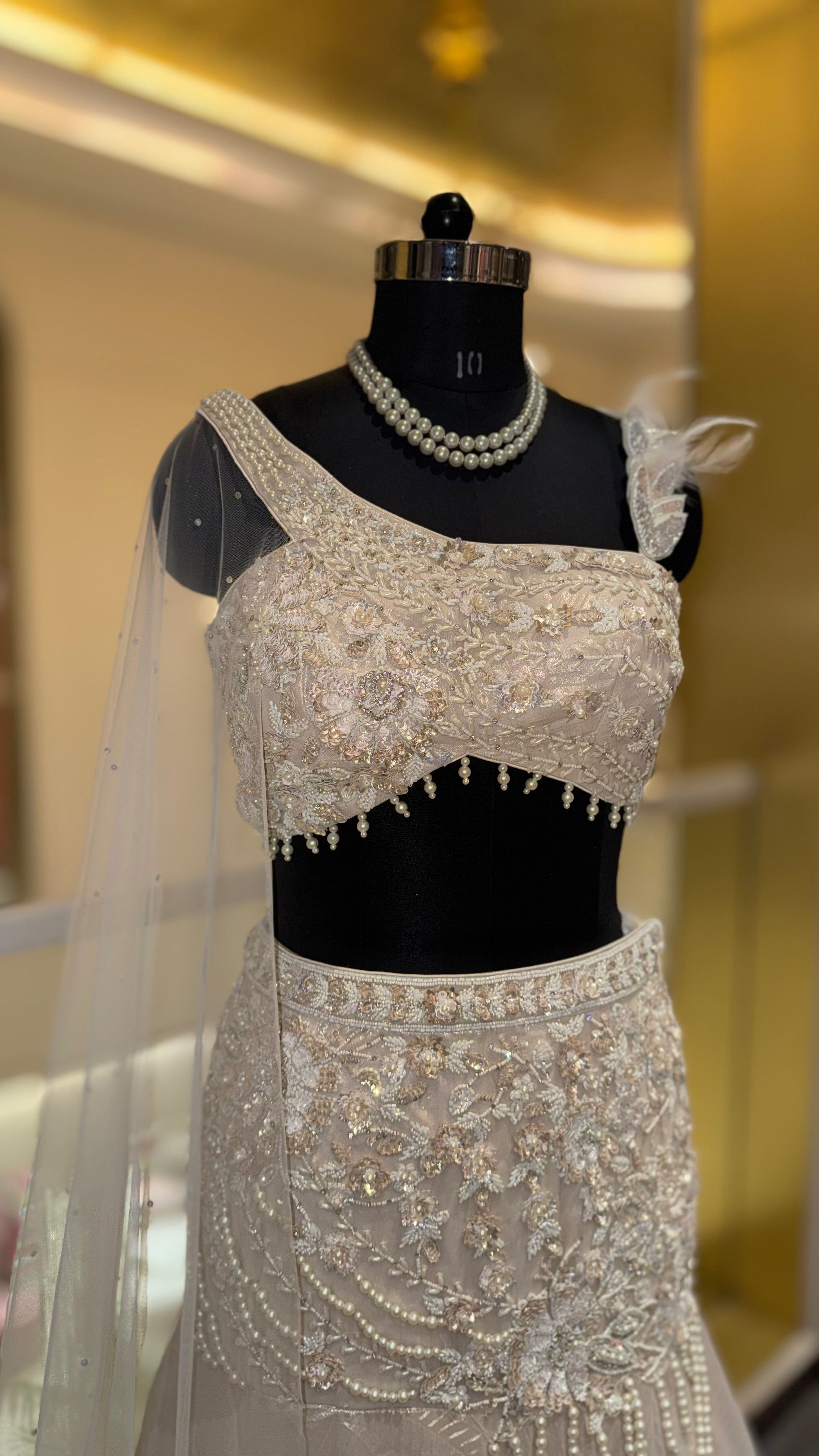 Luxury Pearl White Designer Embroidered Lehenga Set with One-Shoulder Blouse & Net Dupatta