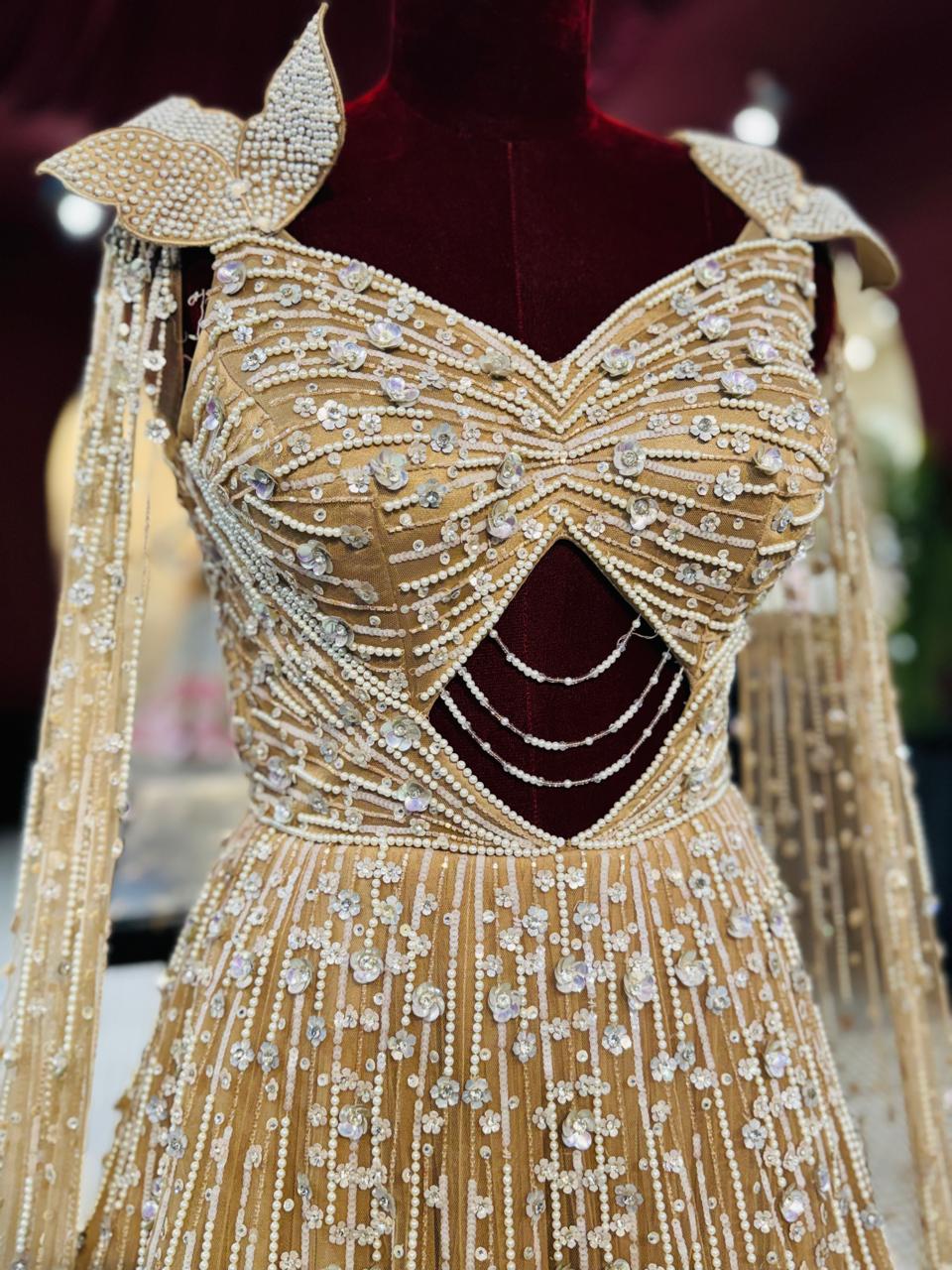 Golden Champagne Couture Gown with Diamond-Cut Bodice and Crystal Droplets
