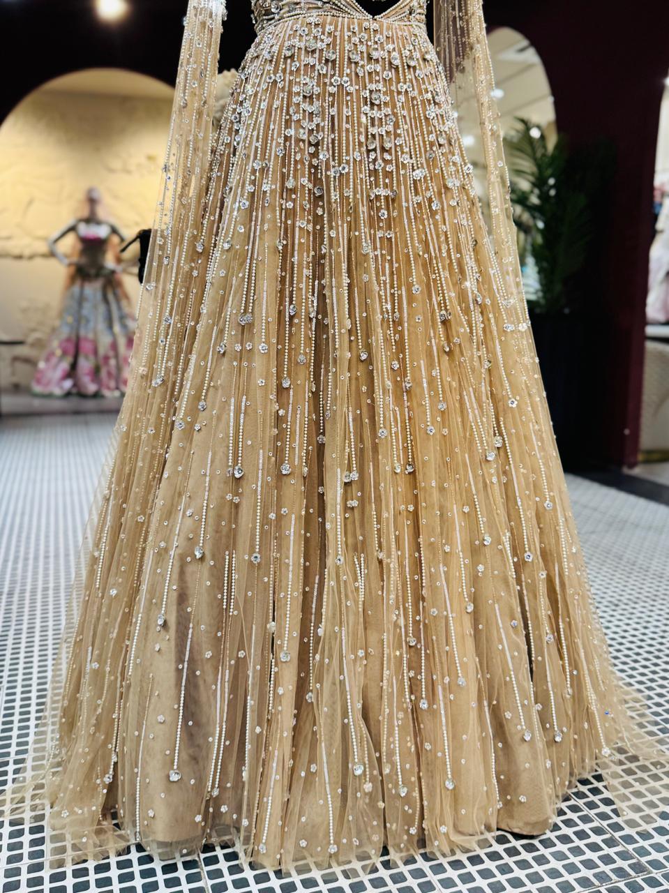 Golden Champagne Couture Gown with Diamond-Cut Bodice and Crystal Droplets