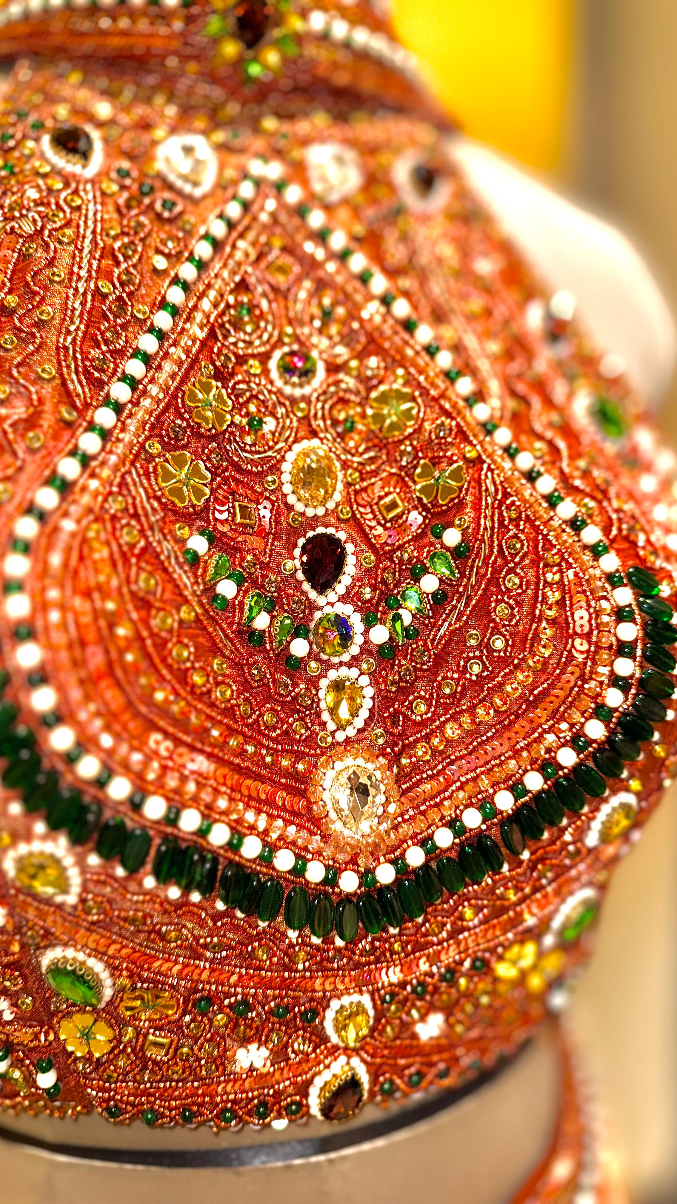 Rust-Orange Lehenga with Heavily Embellished Halter-Neck Blouse