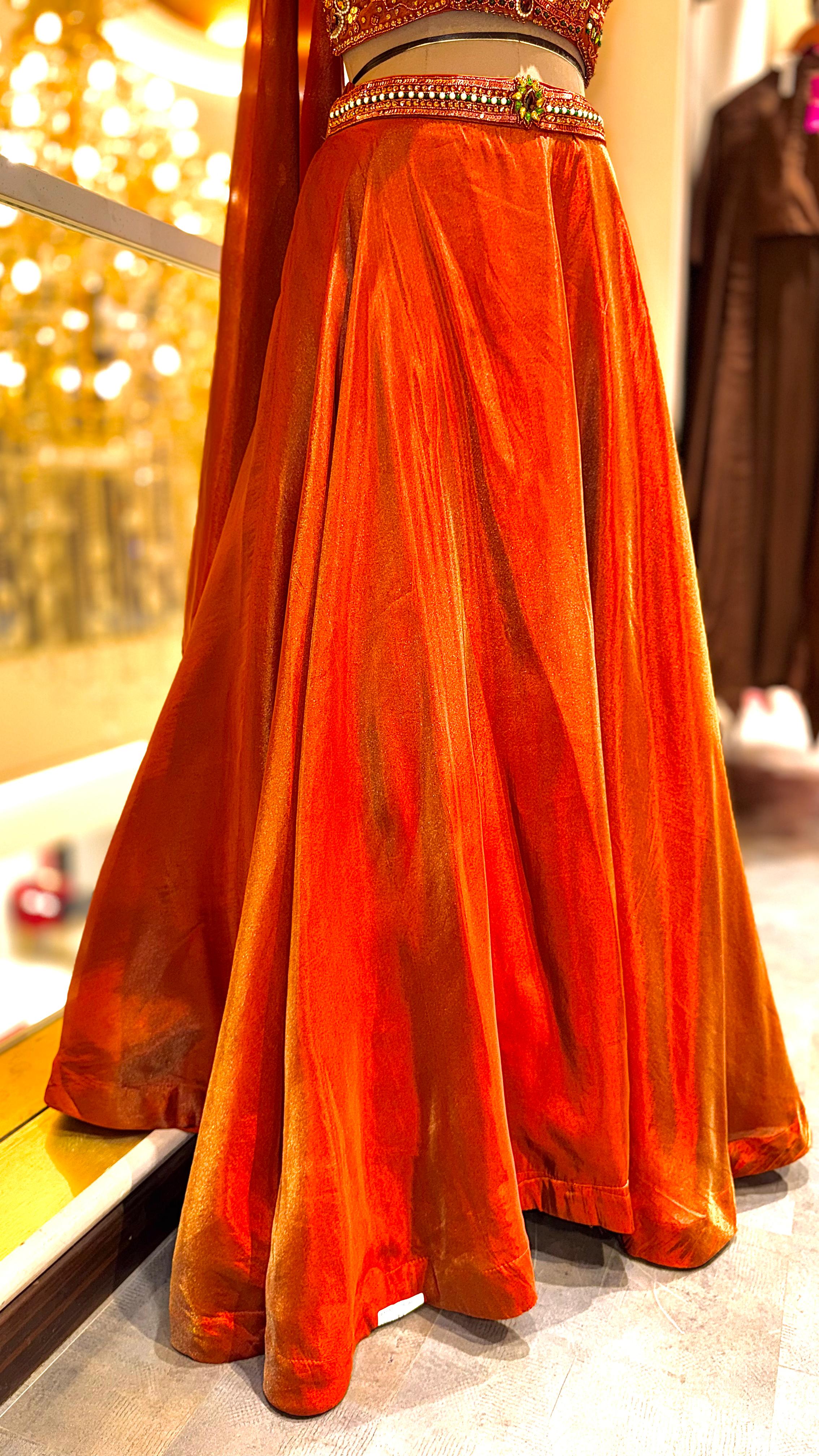 Rust-Orange Lehenga with Heavily Embellished Halter-Neck Blouse