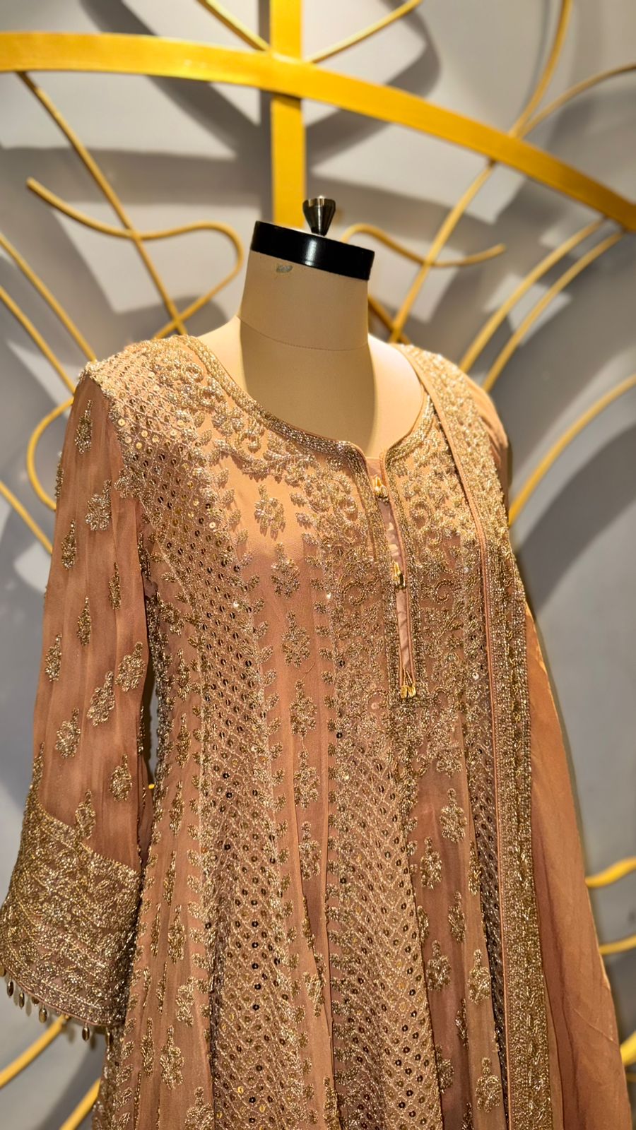 Designer Peach-Gold Peplum Sharara Set with Intricate Zari and Mirror Work