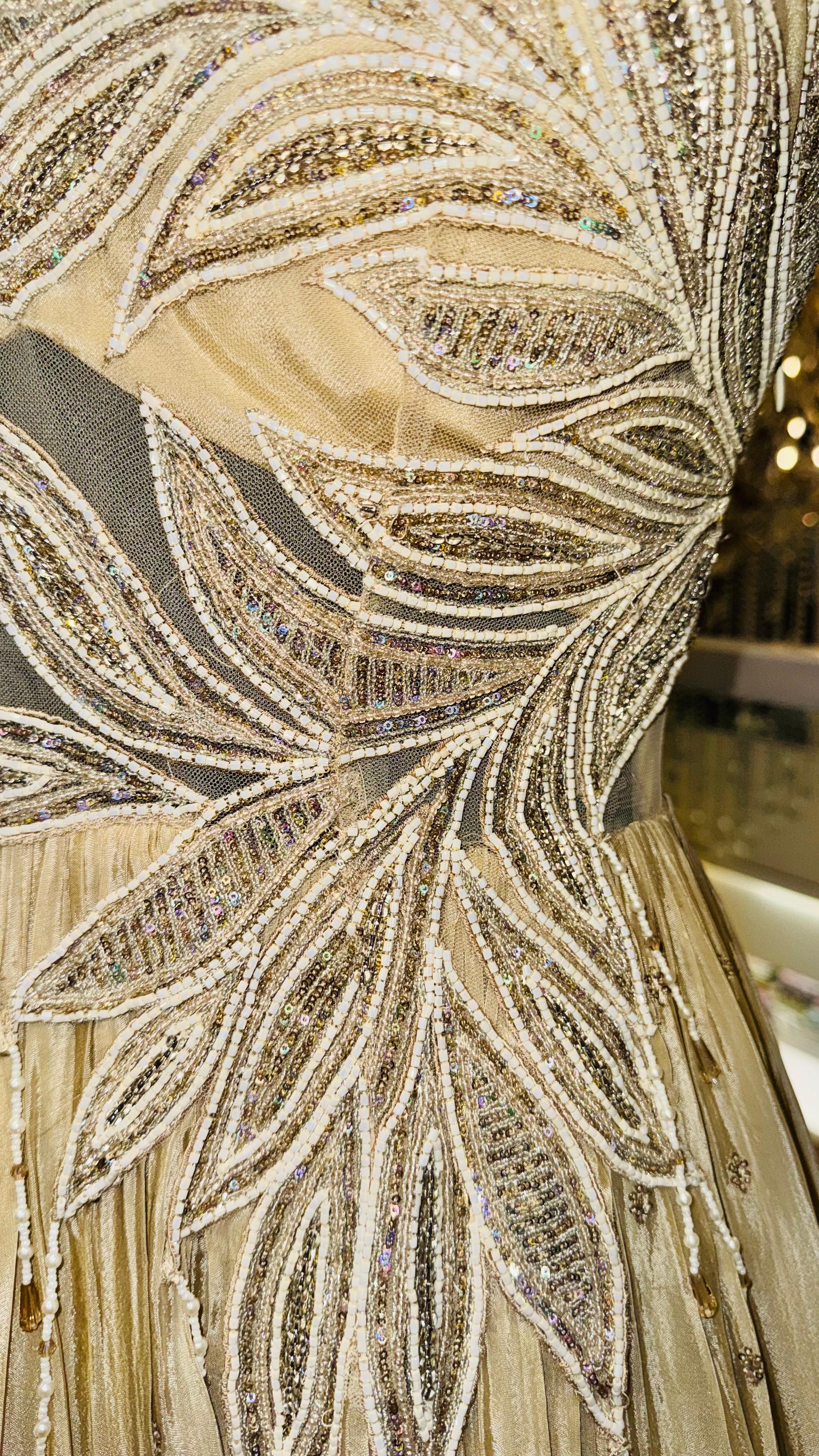 Designer Champagne Gold Gown with Asymmetric Leaf Embroidery and Tiered Pleats