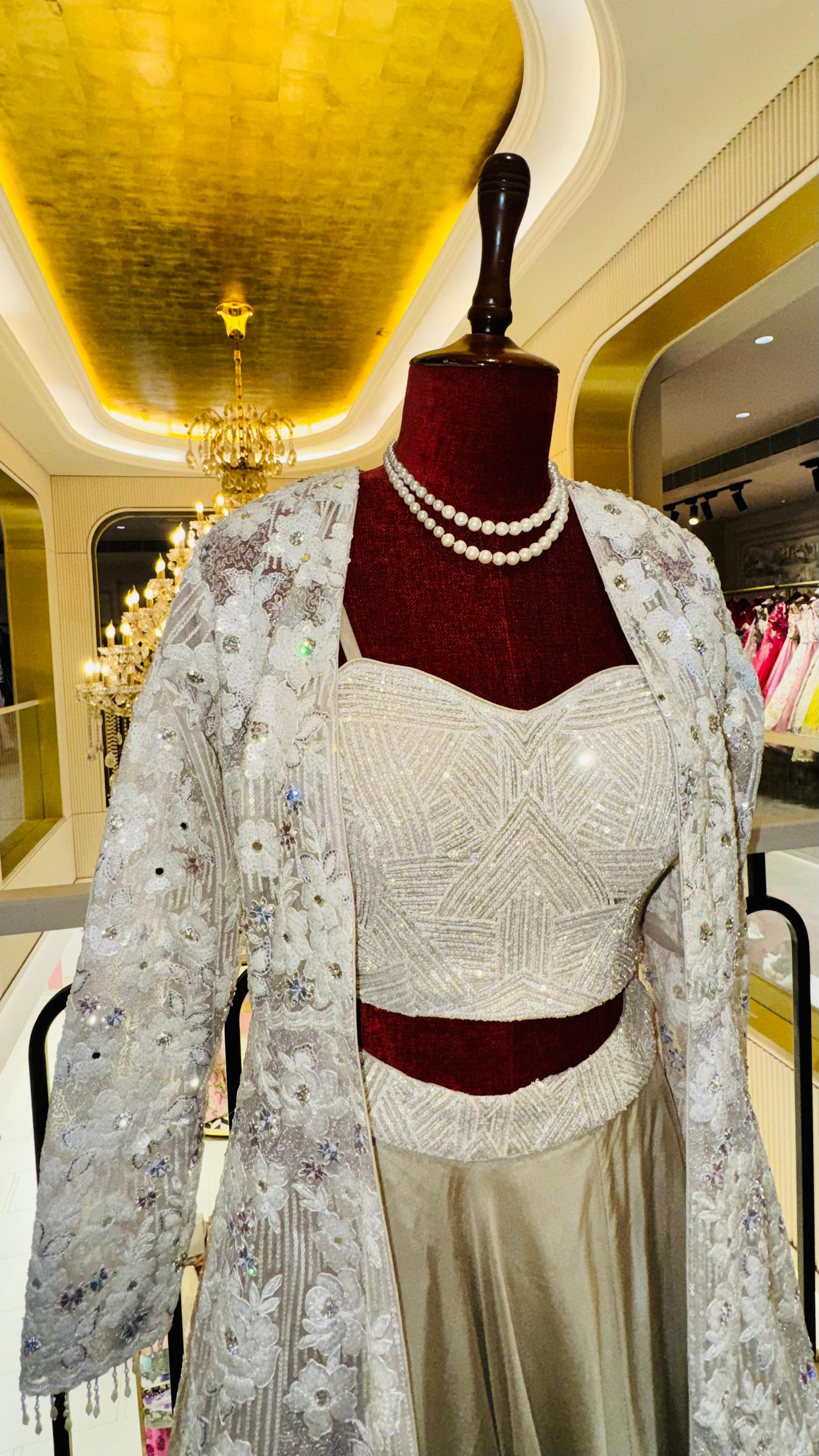 Designer Ivory 3-Piece Lehenga Set with Heavily Embroidered Long Jacket and Sweetheart Bustier