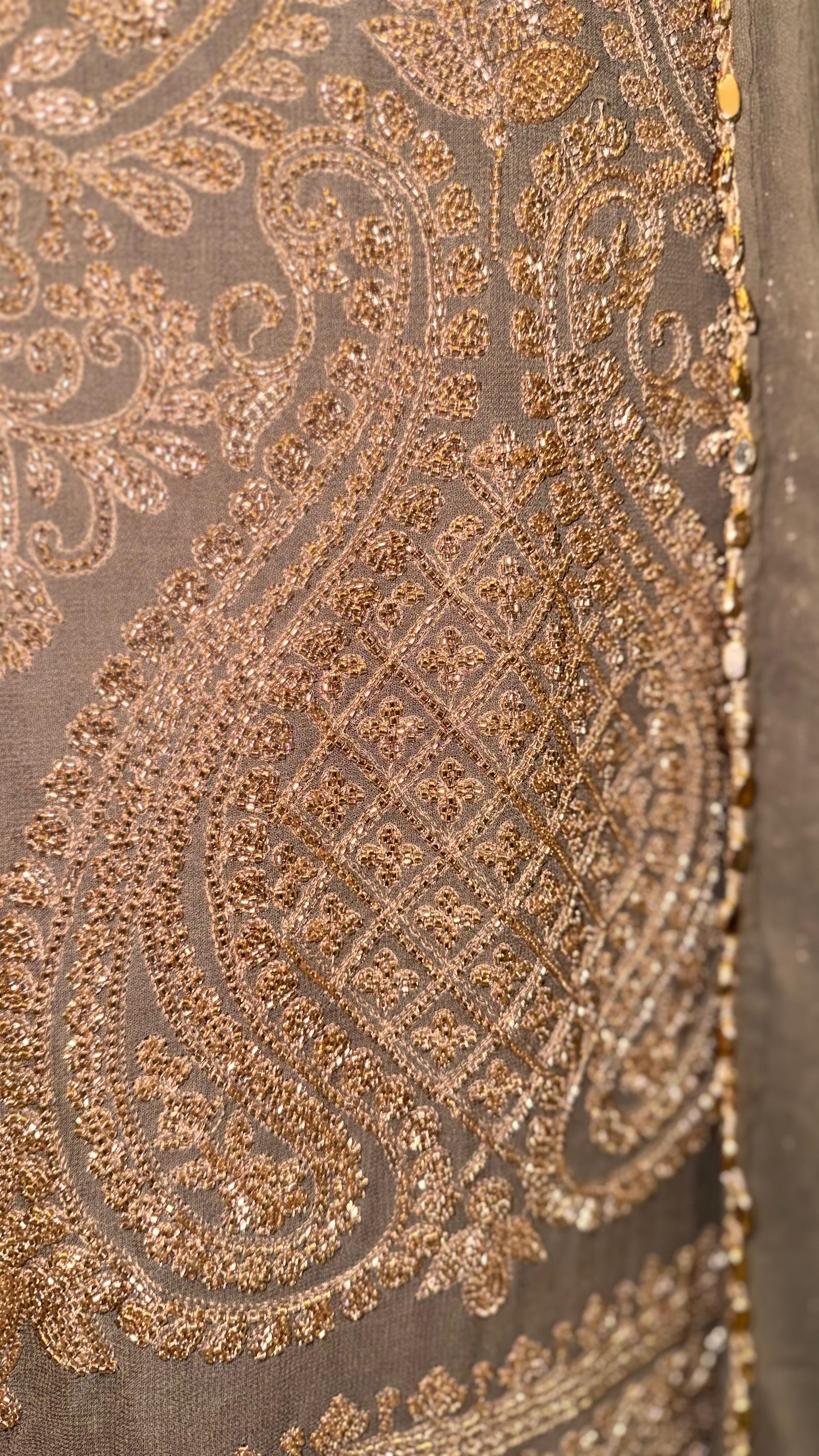 Vibrant Mustard Yellow Georgette Suit with Intricate White Floral Print and Sparkling Sequins