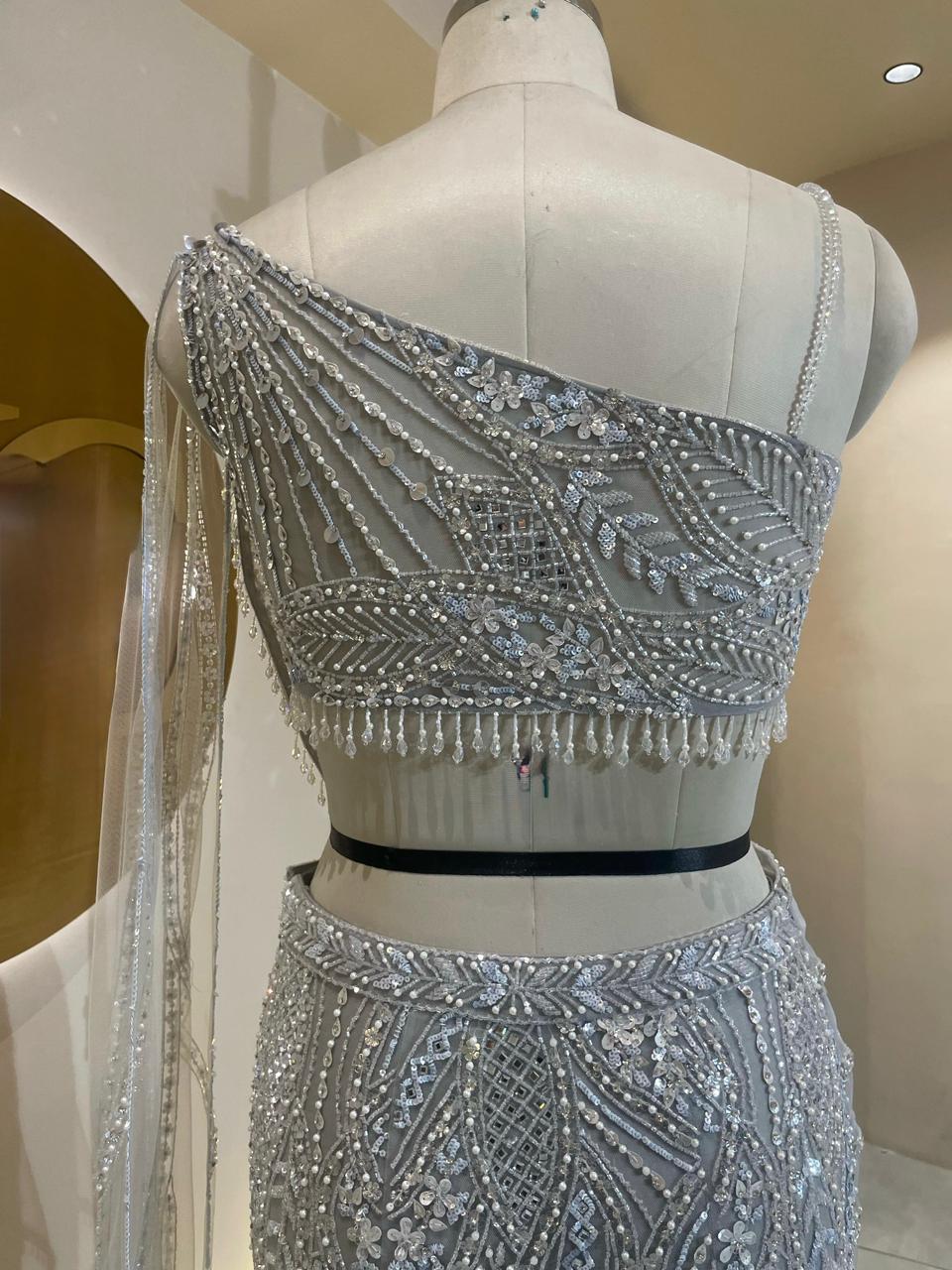 Designer Silver-Grey Fishcut Lehenga with Pre-Draped Saree Silhouette and Crystal Embellishments
