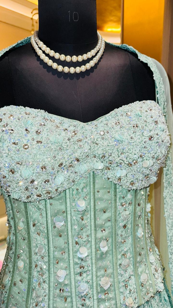 Seafoam Green Corset Lehenga with Heavy Vertical Sequin Paneling and Sheer Cape Dupatta
