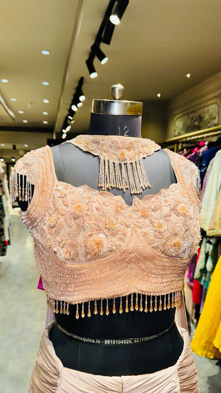 Designer Rose Gold Fishcut Lehenga with Ruched Chevron Detailing and Pearl-Fringe Choker Bustier
