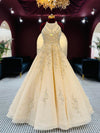 Premium Champagne Halter-Neck Gown with Heavy Pearl and Zari Embellishments