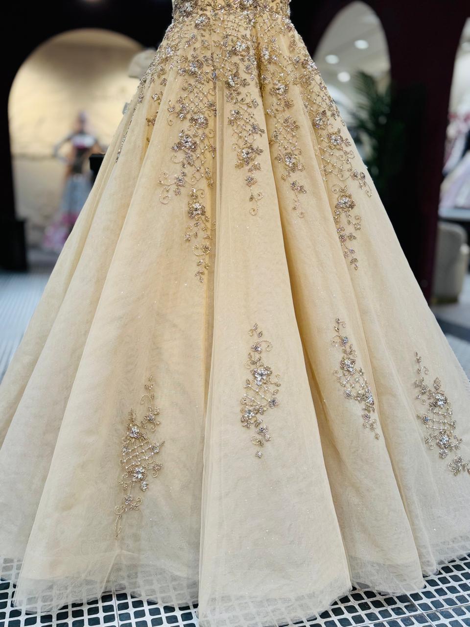 Premium Champagne Halter-Neck Gown with Heavy Pearl and Zari Embellishments