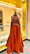 Rust-Orange Lehenga with Heavily Embellished Halter-Neck Blouse