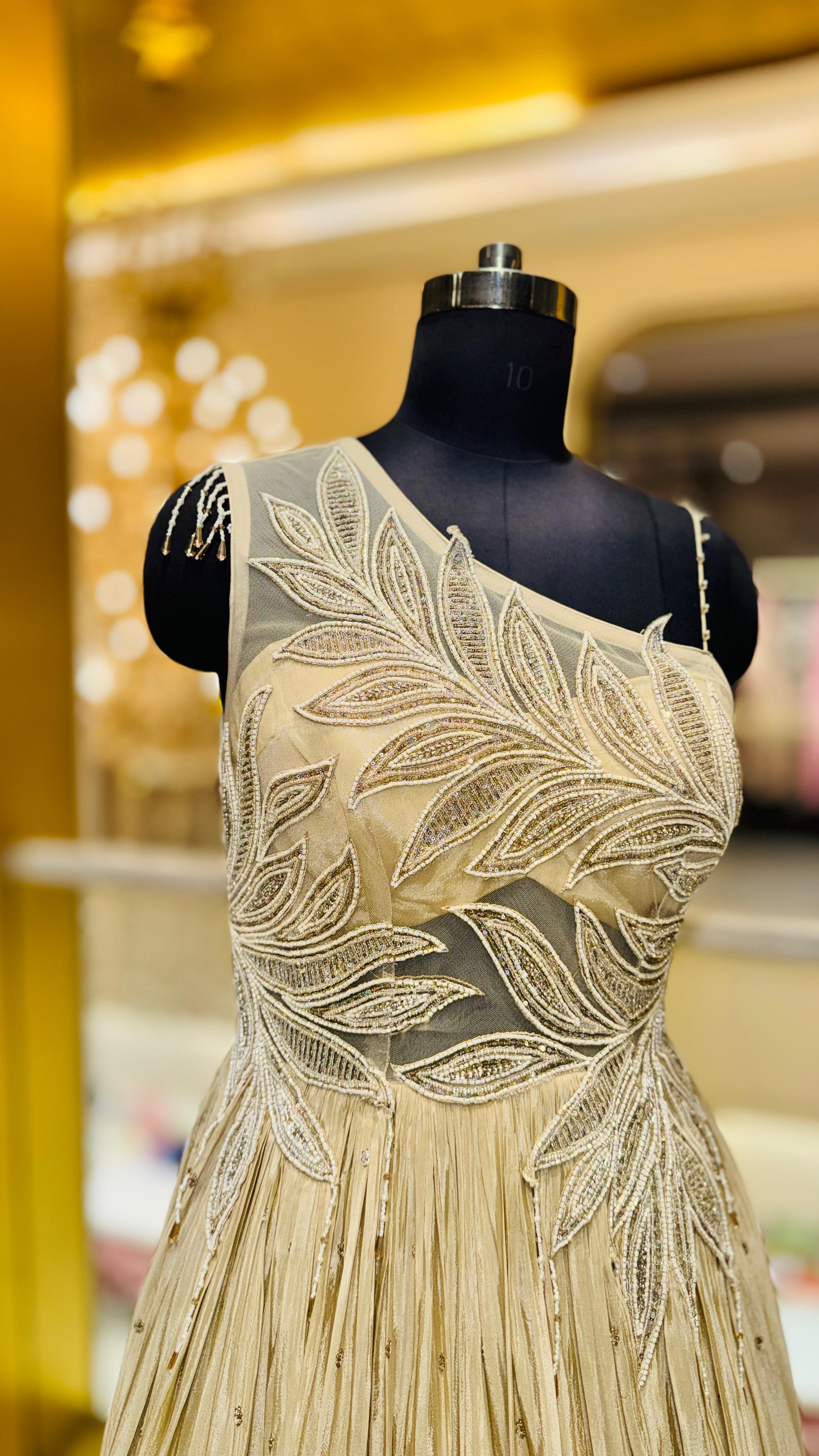 Designer Champagne Gold Gown with Asymmetric Leaf Embroidery and Tiered Pleats