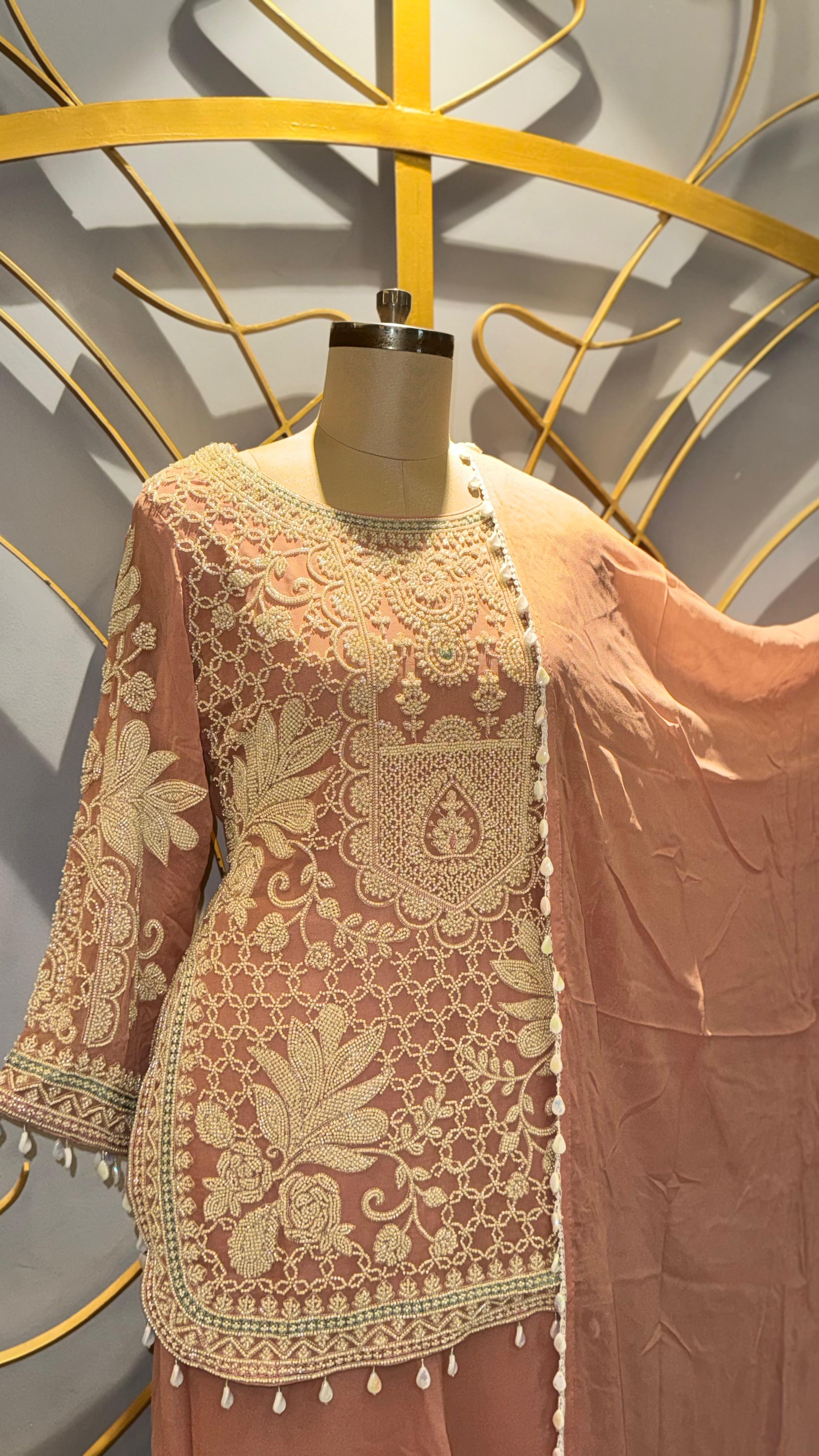 Designer Rust Orange Georgette Suit with Intricate White Threadwork and Pearl Hangings