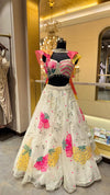Designer Ivory Organza Lehenga with Candy Pink & Yellow 3D Appliqué and Ruffled Cape Sleeves