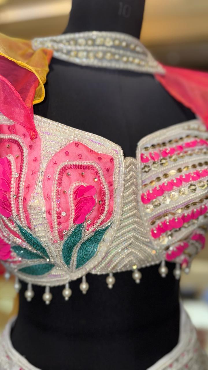 Designer Ivory Organza Lehenga with Candy Pink & Yellow 3D Appliqué and Ruffled Cape Sleeves