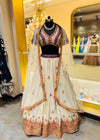 Premium Off-White Georgette Lehenga with Violet & Red Zari Border and Attached Cape Dupatta