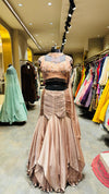 Designer Rose Gold Fishcut Lehenga with Ruched Chevron Detailing and Pearl-Fringe Choker Bustier