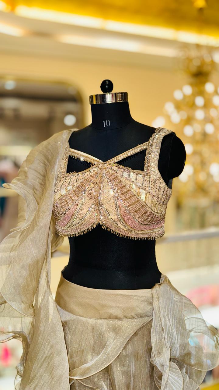 Designer Champagne Gold Ruffled Lehenga with Criss-Cross Strappy Bustier and Attached Organza Trailing Drape